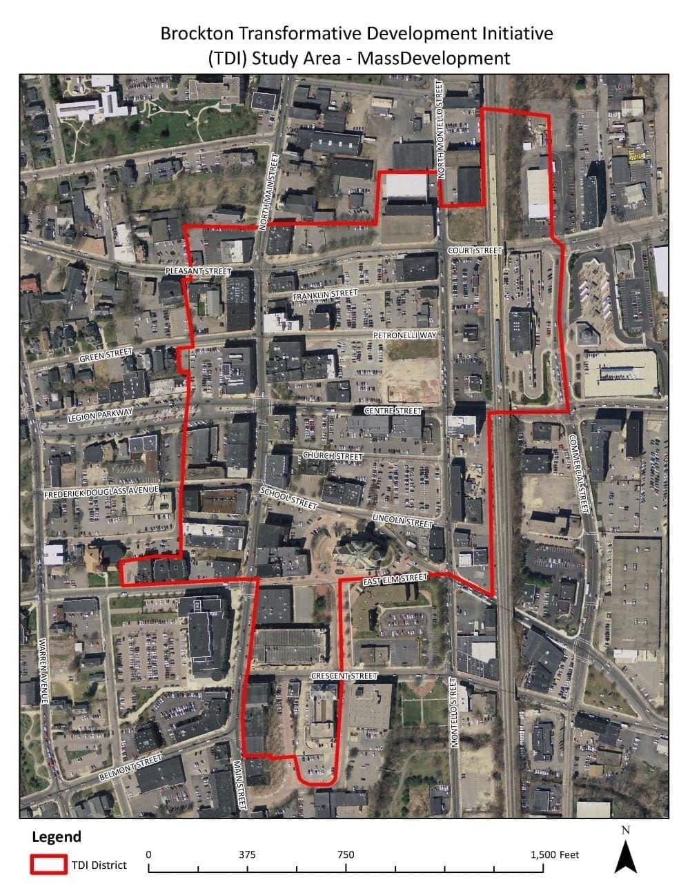 An aerial map of downtown Brockton shows the Transformative Development Initiative (TDI) study area outlined in red. Major streets, buildings, parking lots, and the rail corridor are visible within and around the boundary, with a scale bar and north arrow at the bottom.